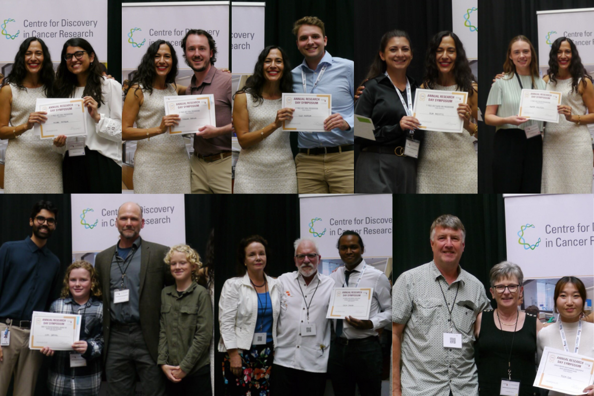 People smiling holding up award certificates